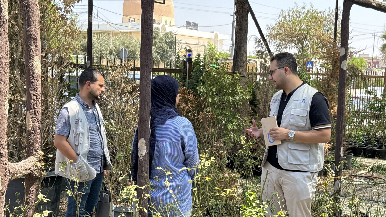 AGO staff meeting participants in a plant nursery