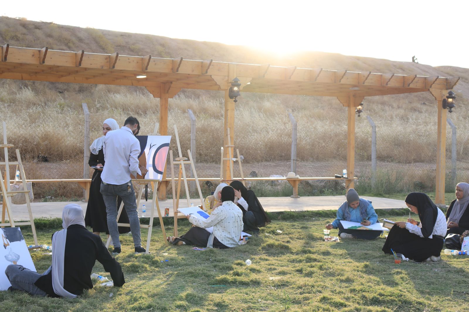 Young people painting outdoors during an Art for Peace day